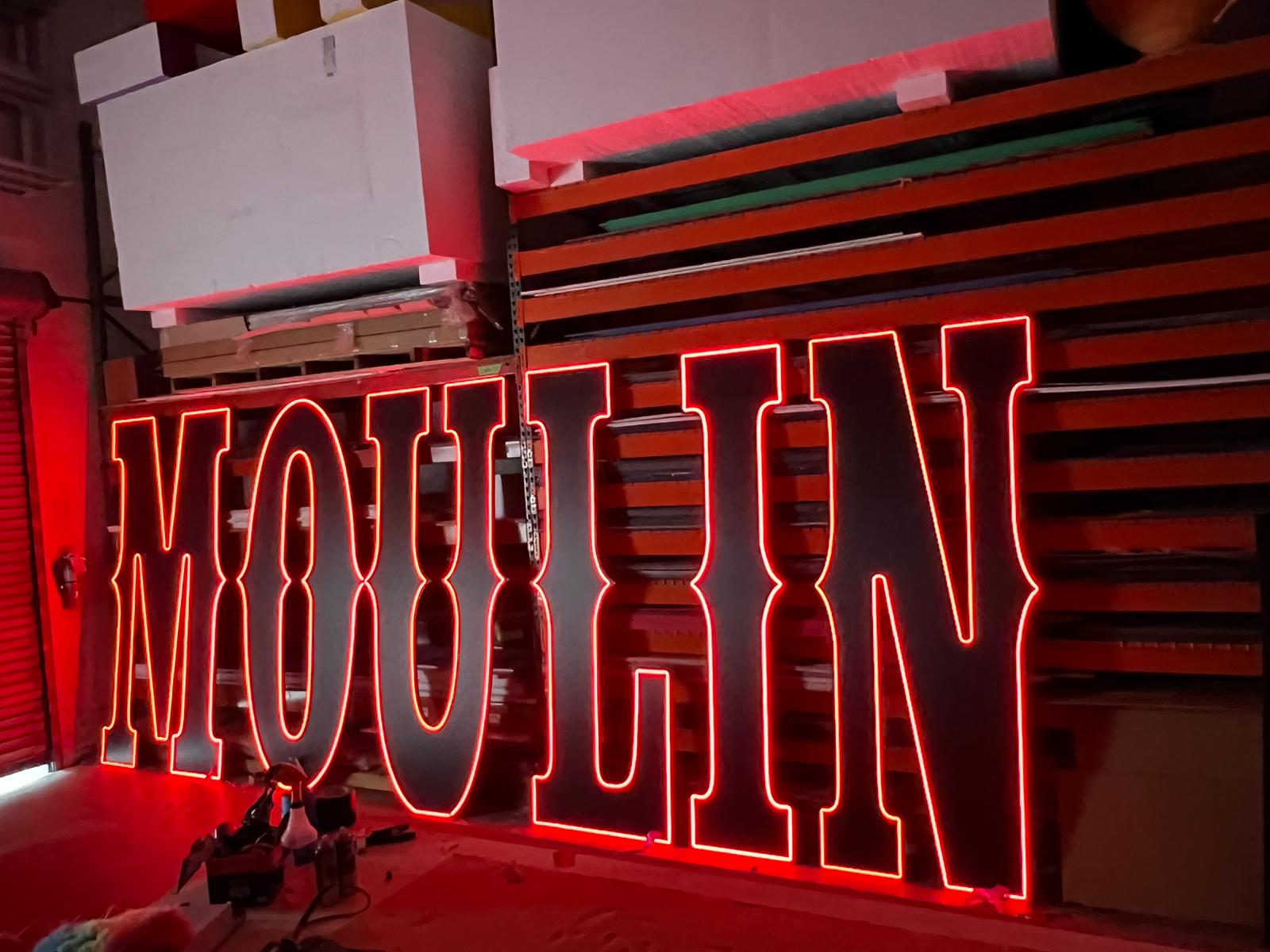 a large neon sign that says bourbon on it