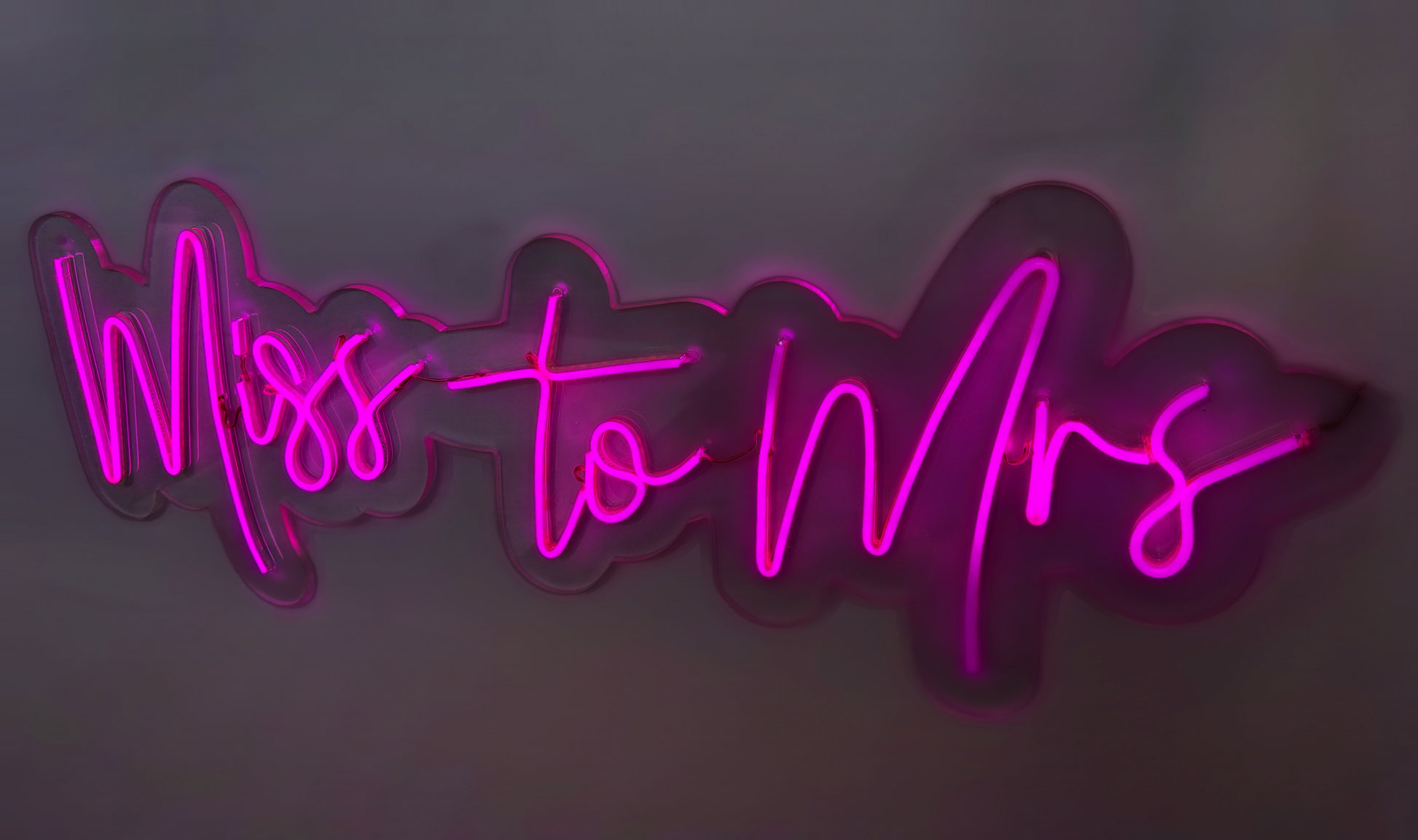 a neon sign that says miss to mrs